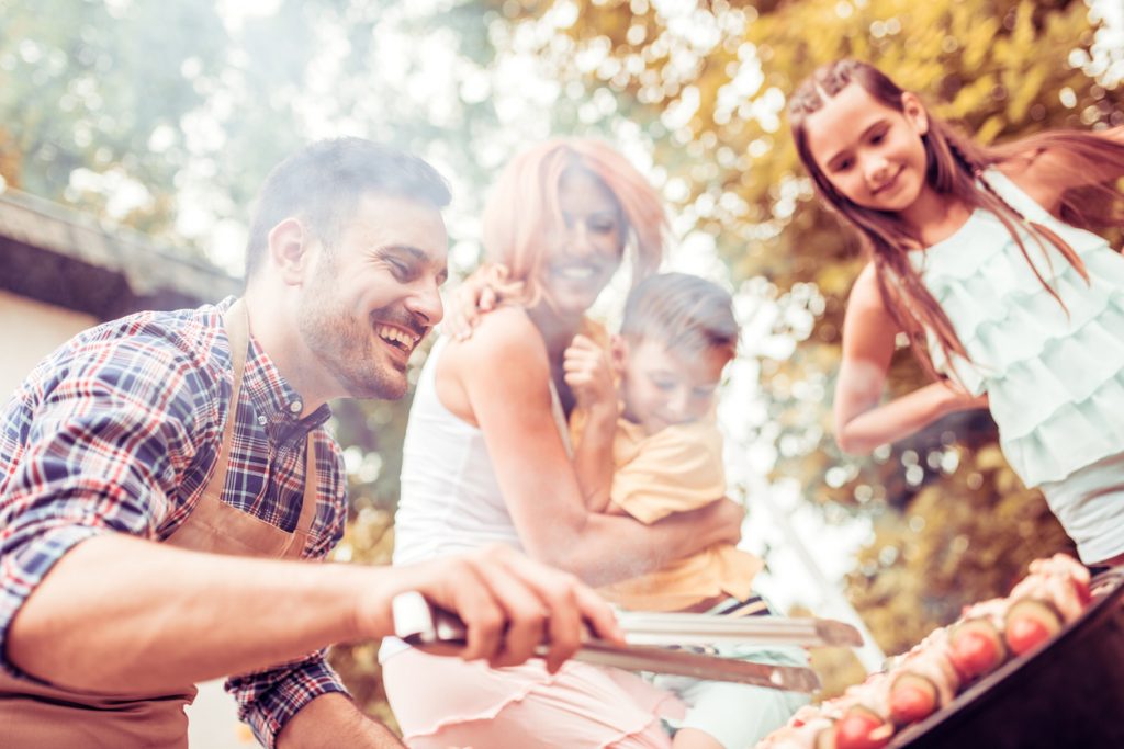 family around a summer bbq