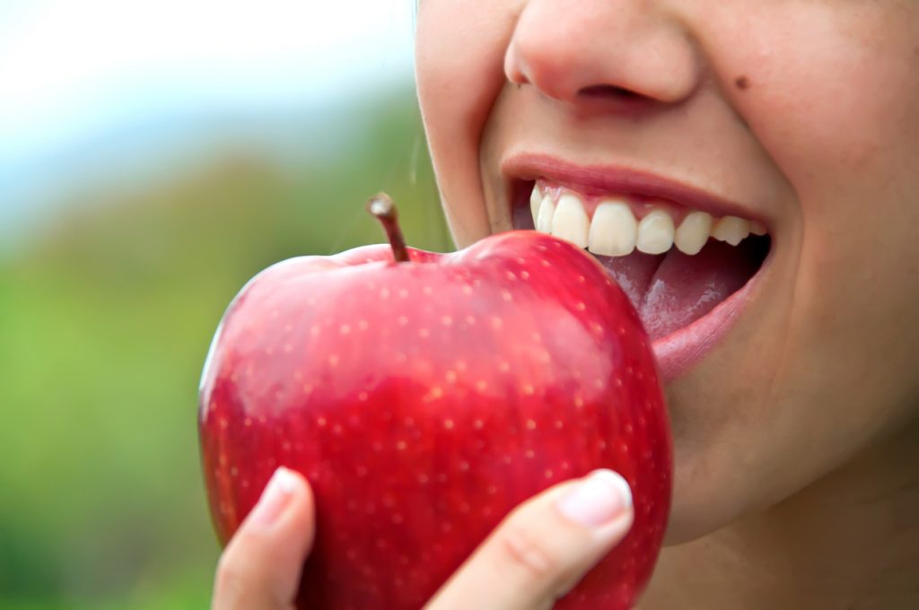 woman-about-to-eat-an-apple