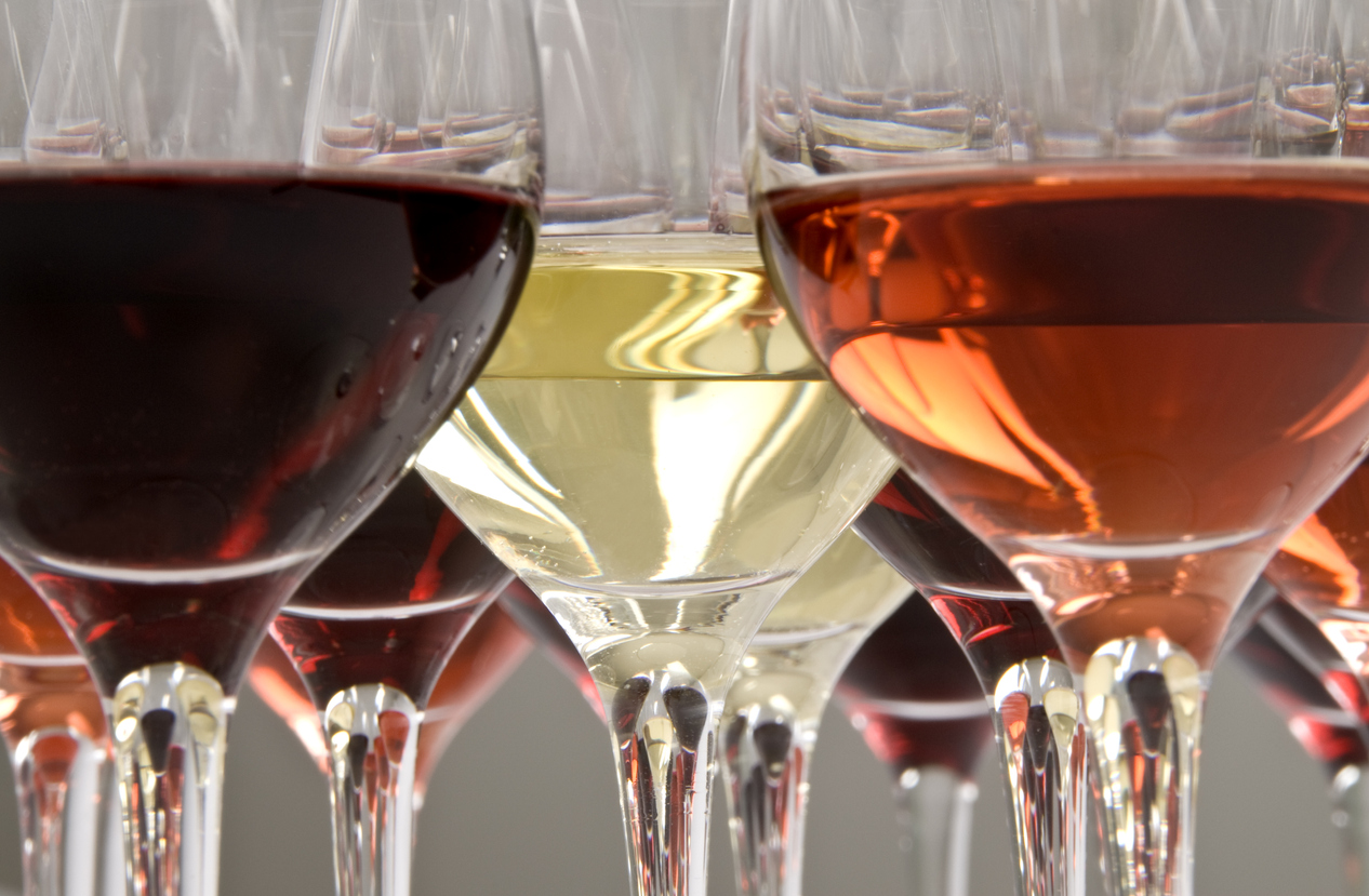 Red, rosé and white wine in crystal glasses